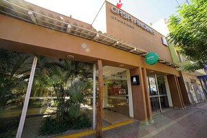 A building with a sign reading "CASA RODRIGUEZ STANDARD".