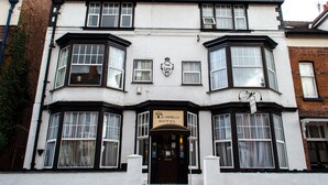 A corner building with bay windows and a sign reading "The Leys Hotel." - Campbell's Guest House (Leicester)