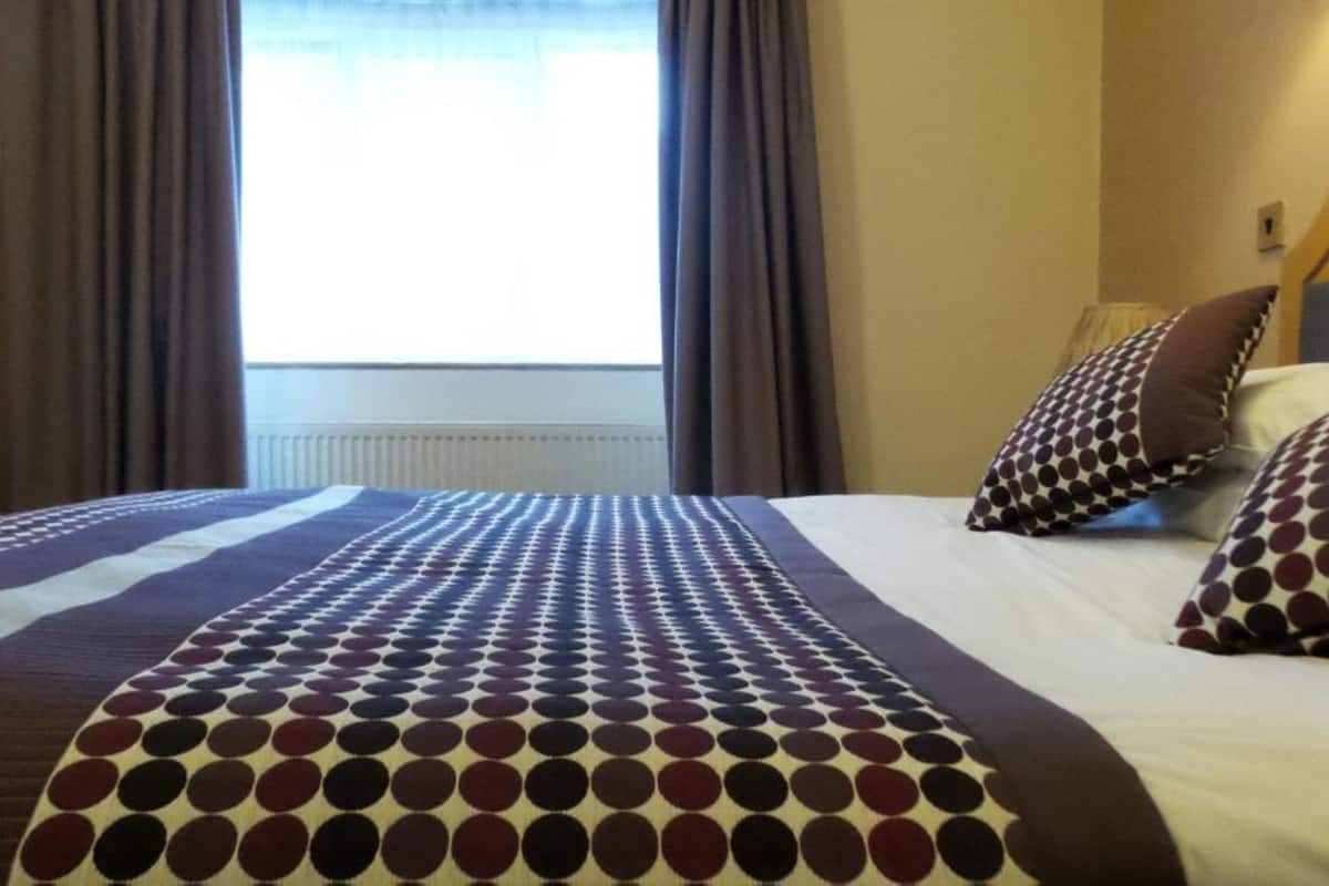 Desk, laptop workspace, free WiFi, bed sheets