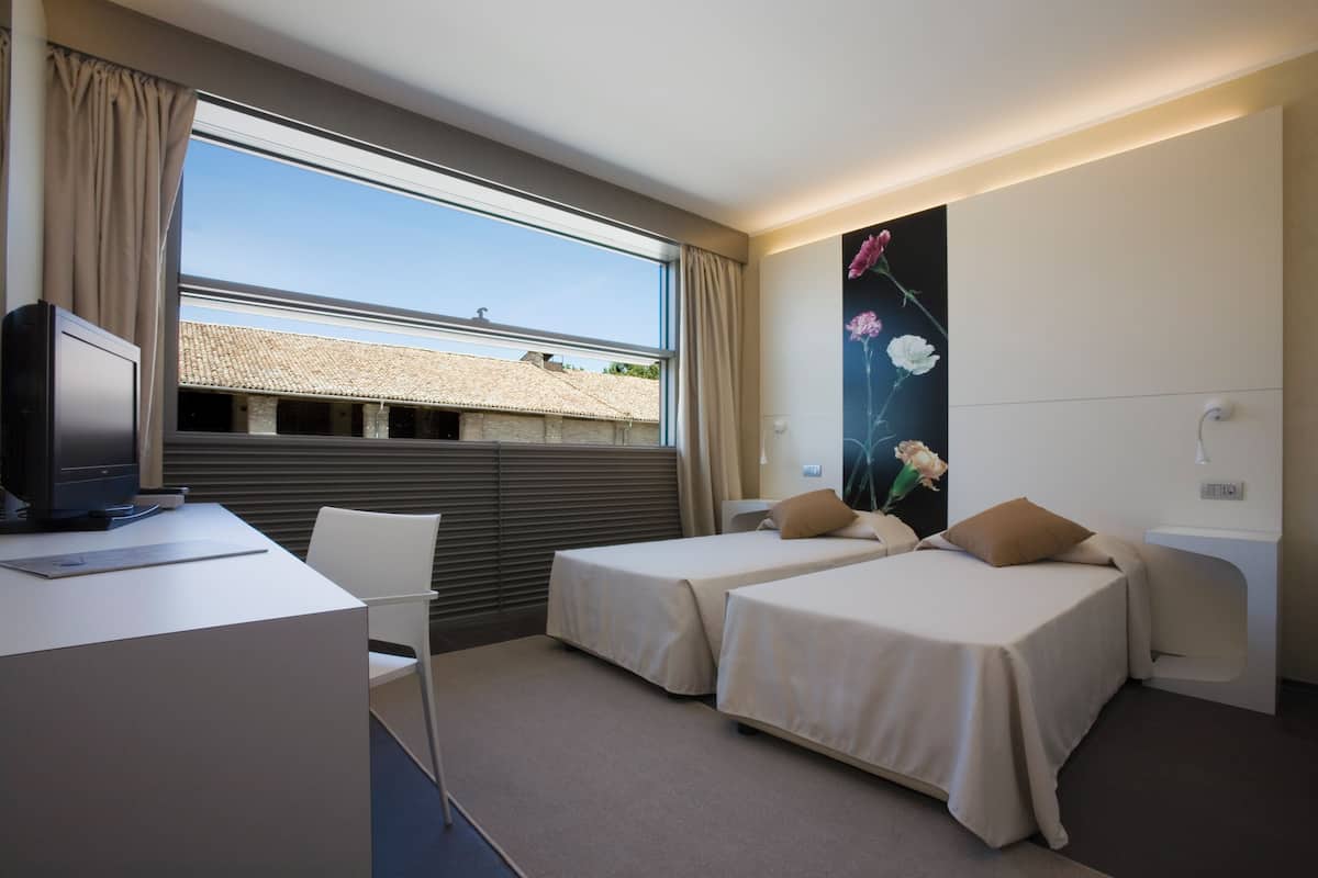 Memory-foam beds, minibar, in-room safe, desk