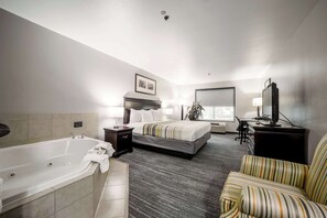 Suite, 1 King Bed, Non Smoking, Jetted Tub | Premium bedding, desk, blackout drapes, iron/ironing board