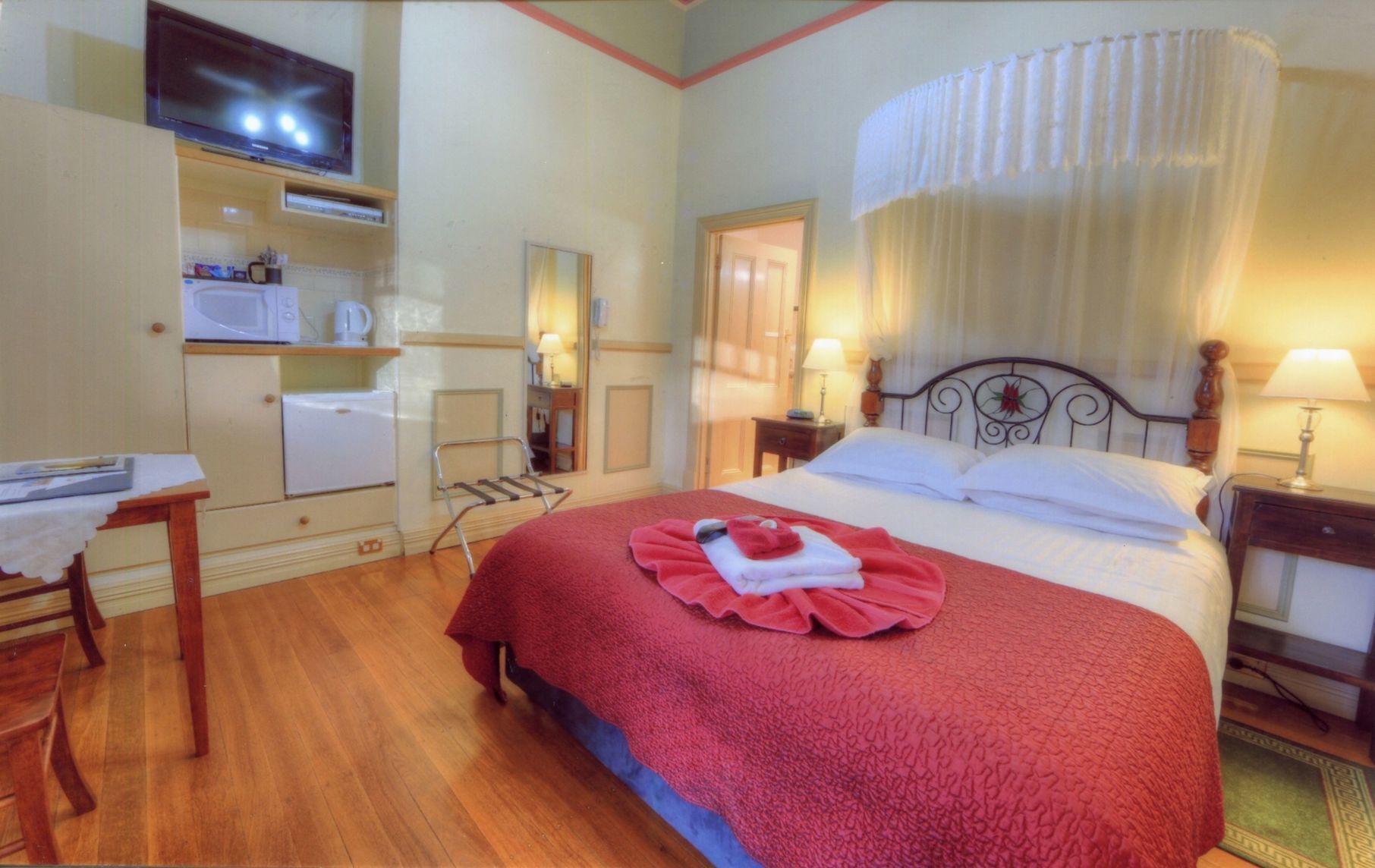 Individually decorated, desk, blackout curtains, iron/ironing board