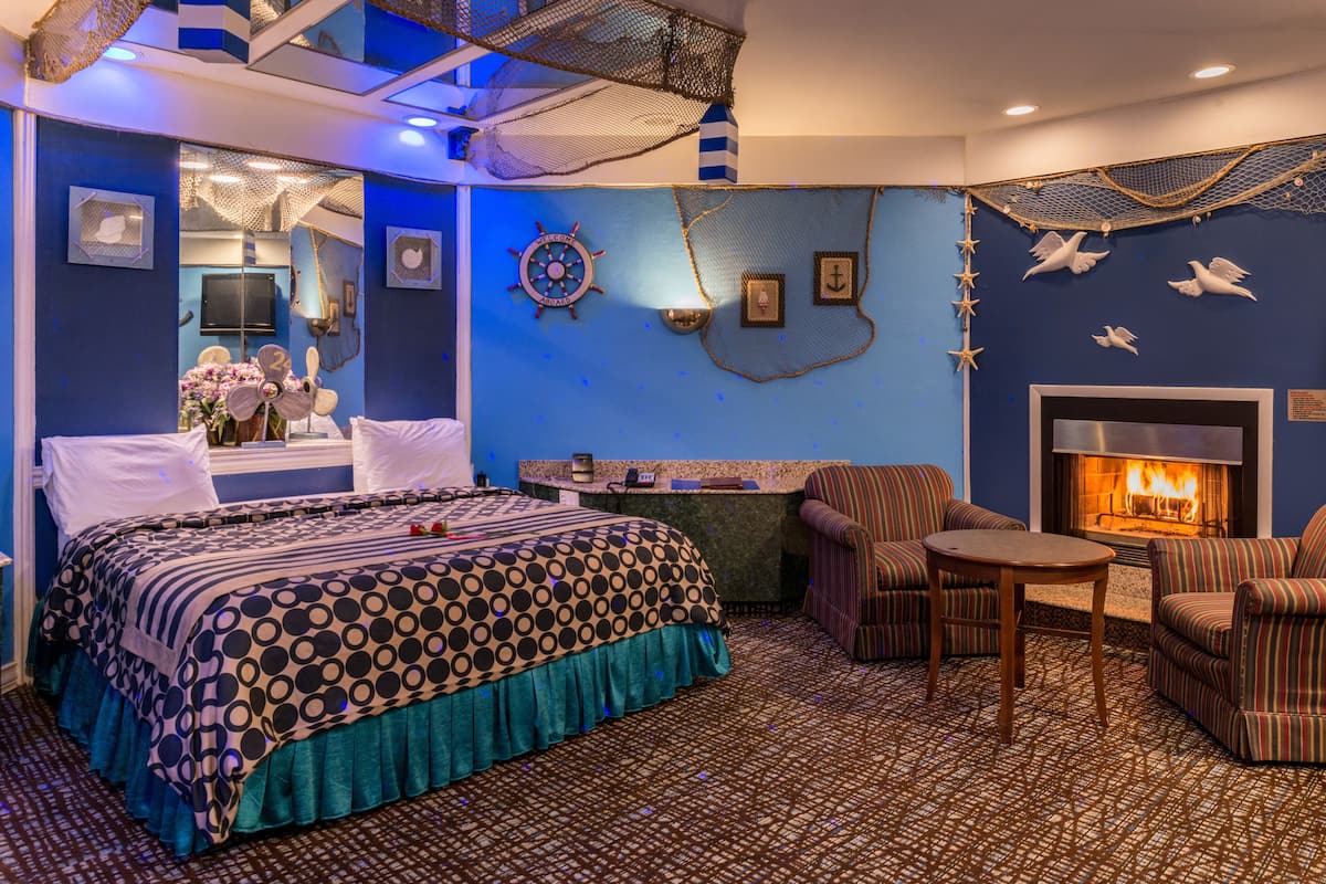 Blue Romantic Theme Suite with Jetted Tub & Fireplace | 1 bedroom, premium bedding, individually furnished, desk