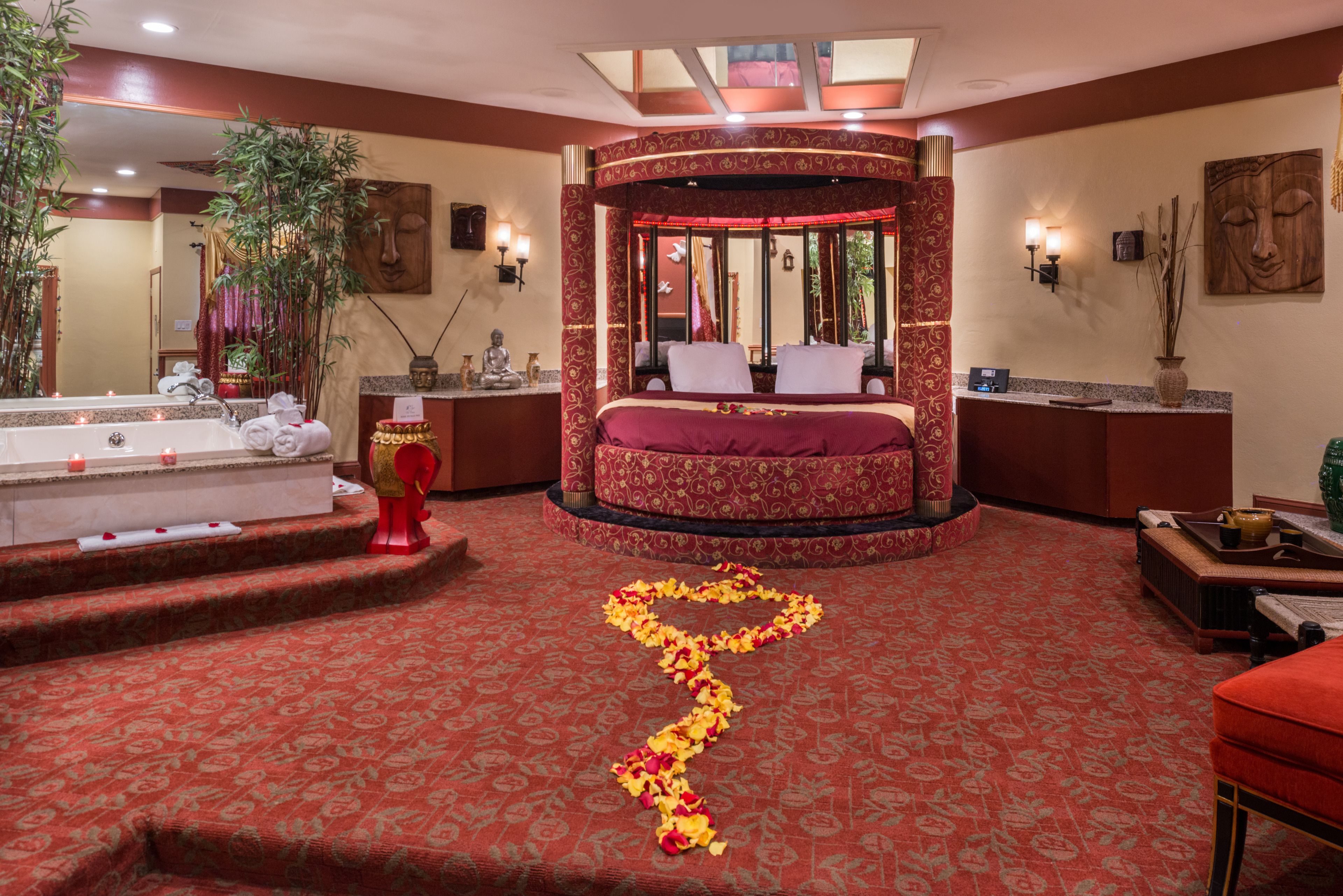 asian theme suite with round bed, jetted tub & fireplace | premium bedding, individually furnished, desk, soundproofing