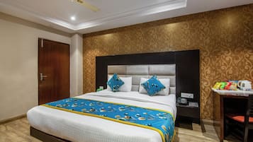 Relax in comfort with a large bed, desk, and amenities at your fingertips.