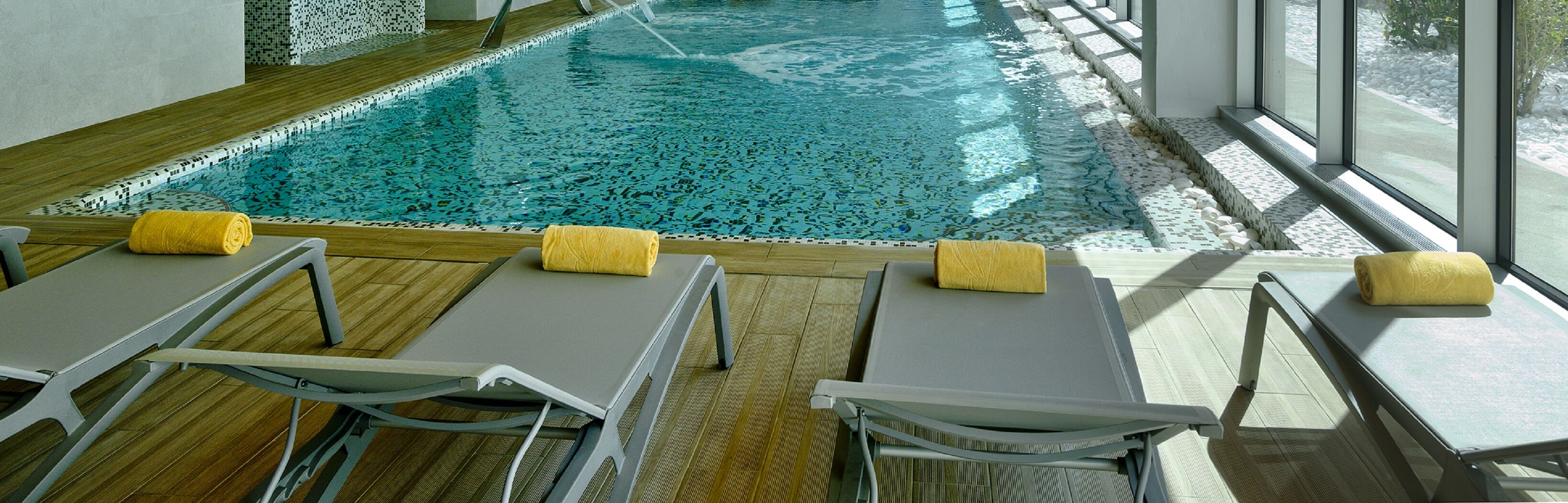 indoor pool, open 7:00 am to 9:00 pm, pool loungers