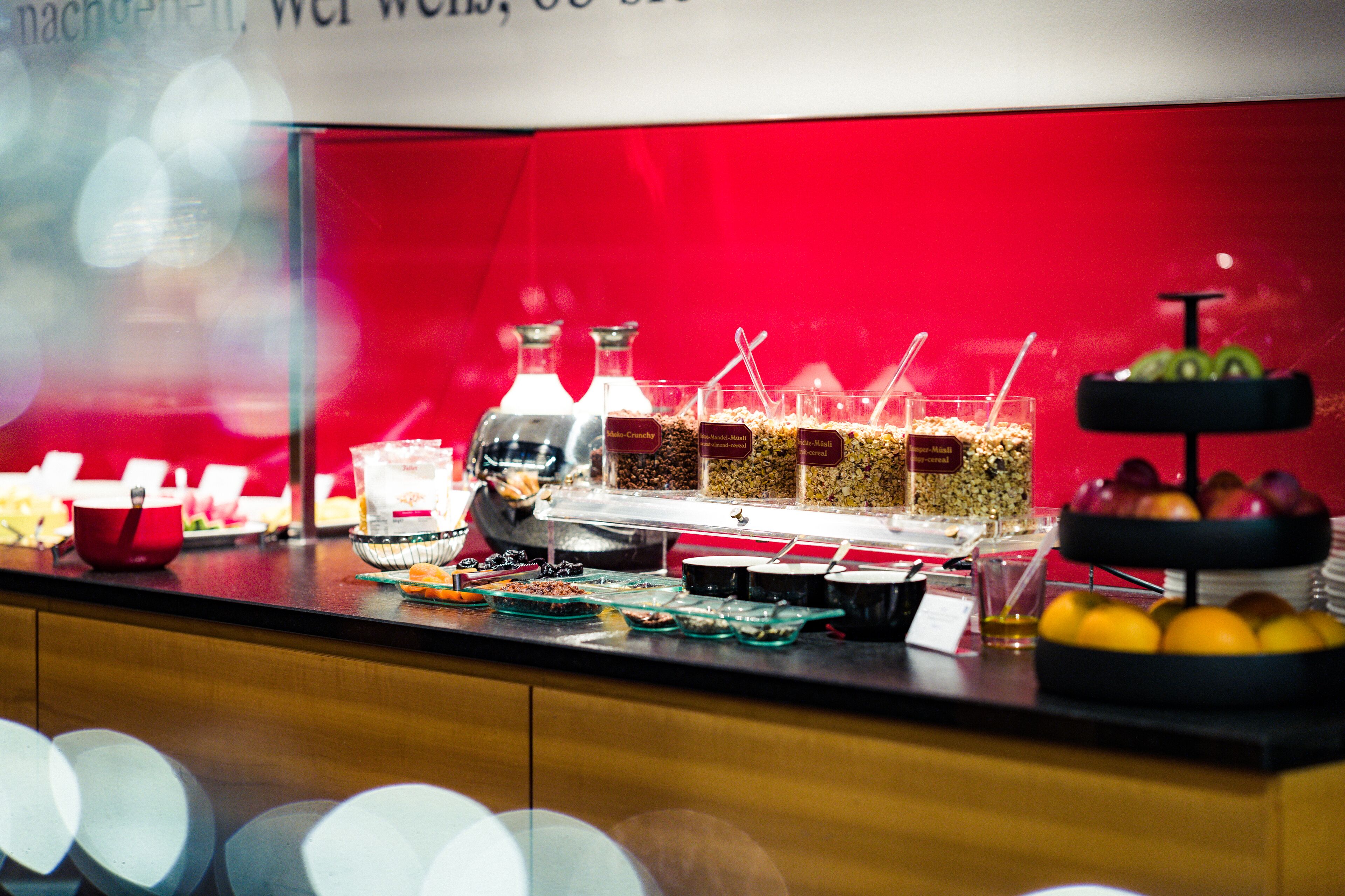 A buffet with various food items and beverages.