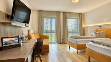 Desk, laptop workspace, blackout drapes, iron/ironing board