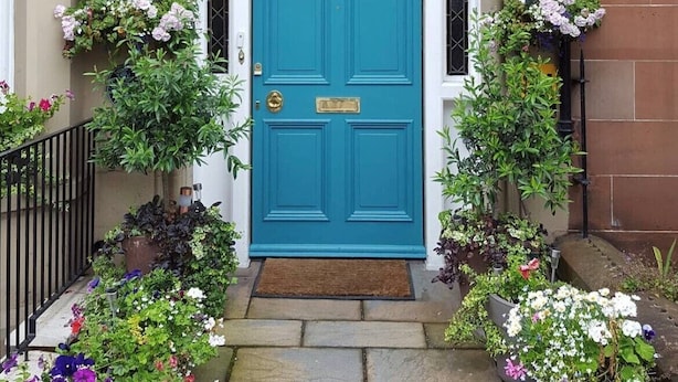 A turquoise door with a sign above reading "Fraoch House." - Fraoch House (Edinburgh)