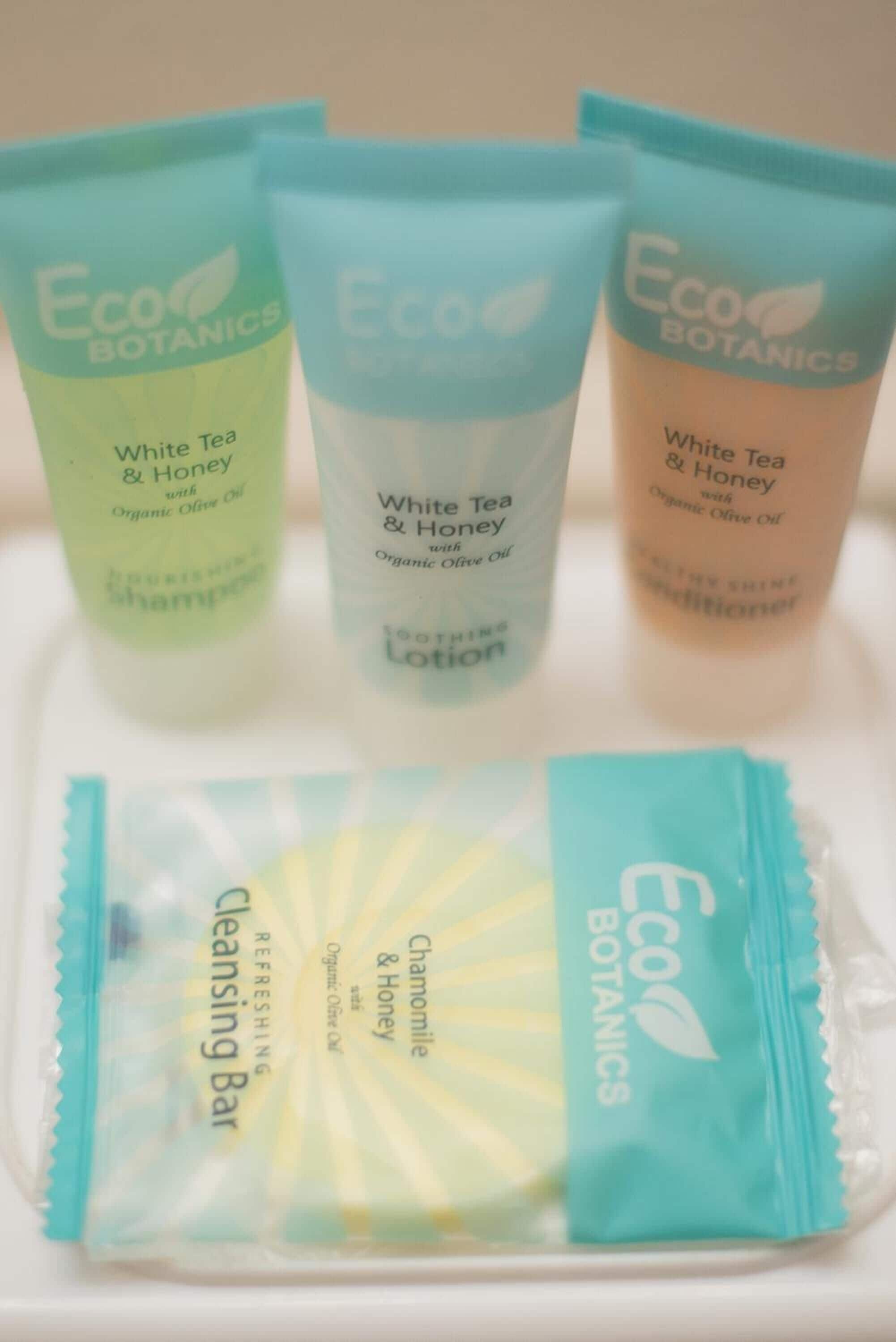 Three bottles of Eco Botanics White Tea & Honey with Organic Olive Oil and a Chamomile & Honey Cleansing Bar.