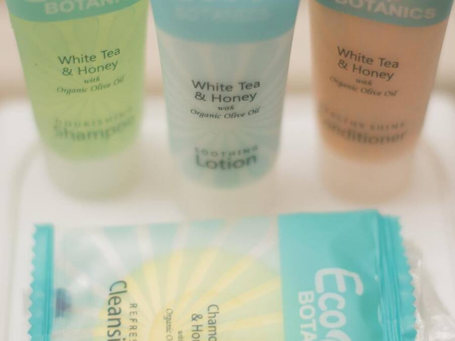 Three bottles of Eco Botanics White Tea & Honey with Organic Olive Oil and a Chamomile & Honey Cleansing Bar.
