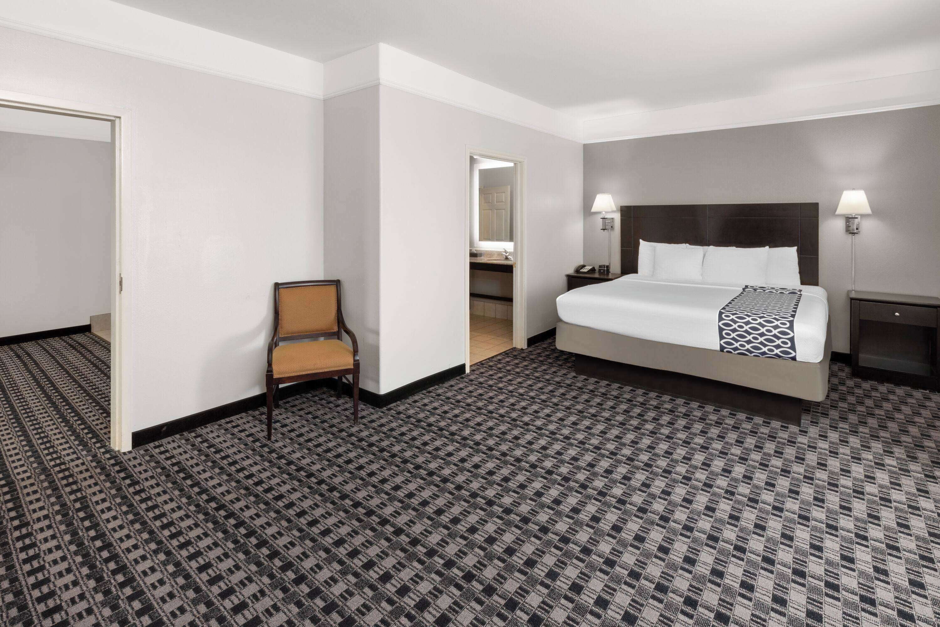 suite, 1 king bed, non smoking | premium bedding, desk, blackout curtains, iron/ironing board