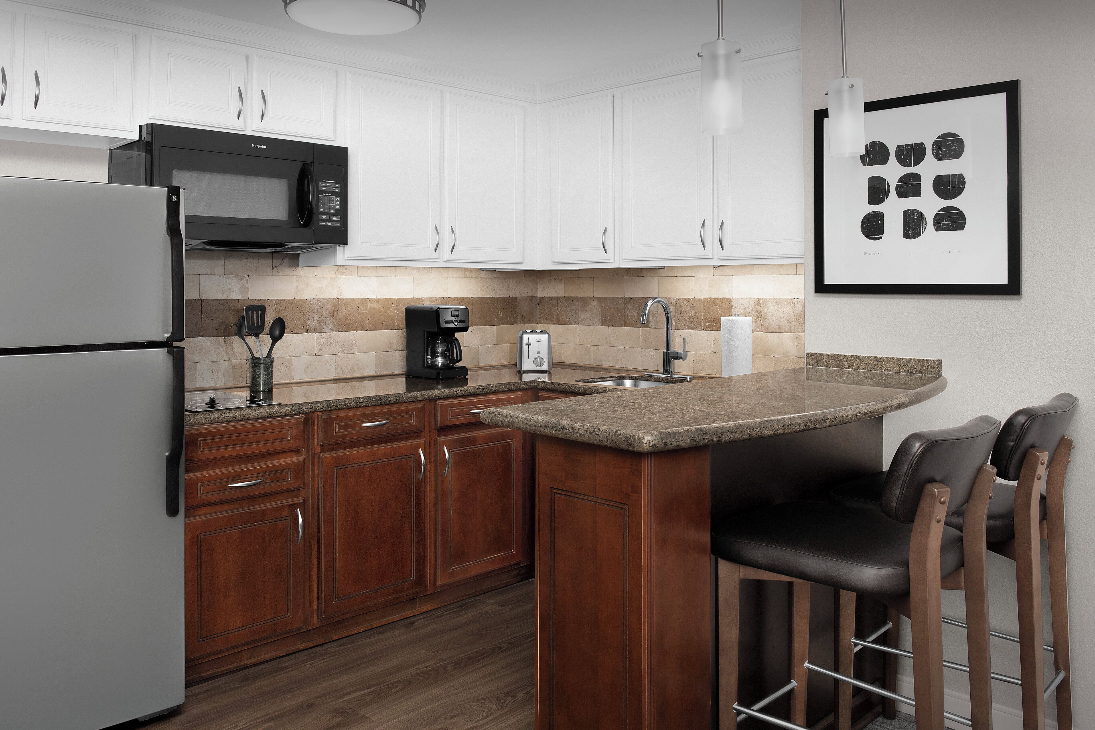 full-sized fridge, microwave, stovetop, dishwasher