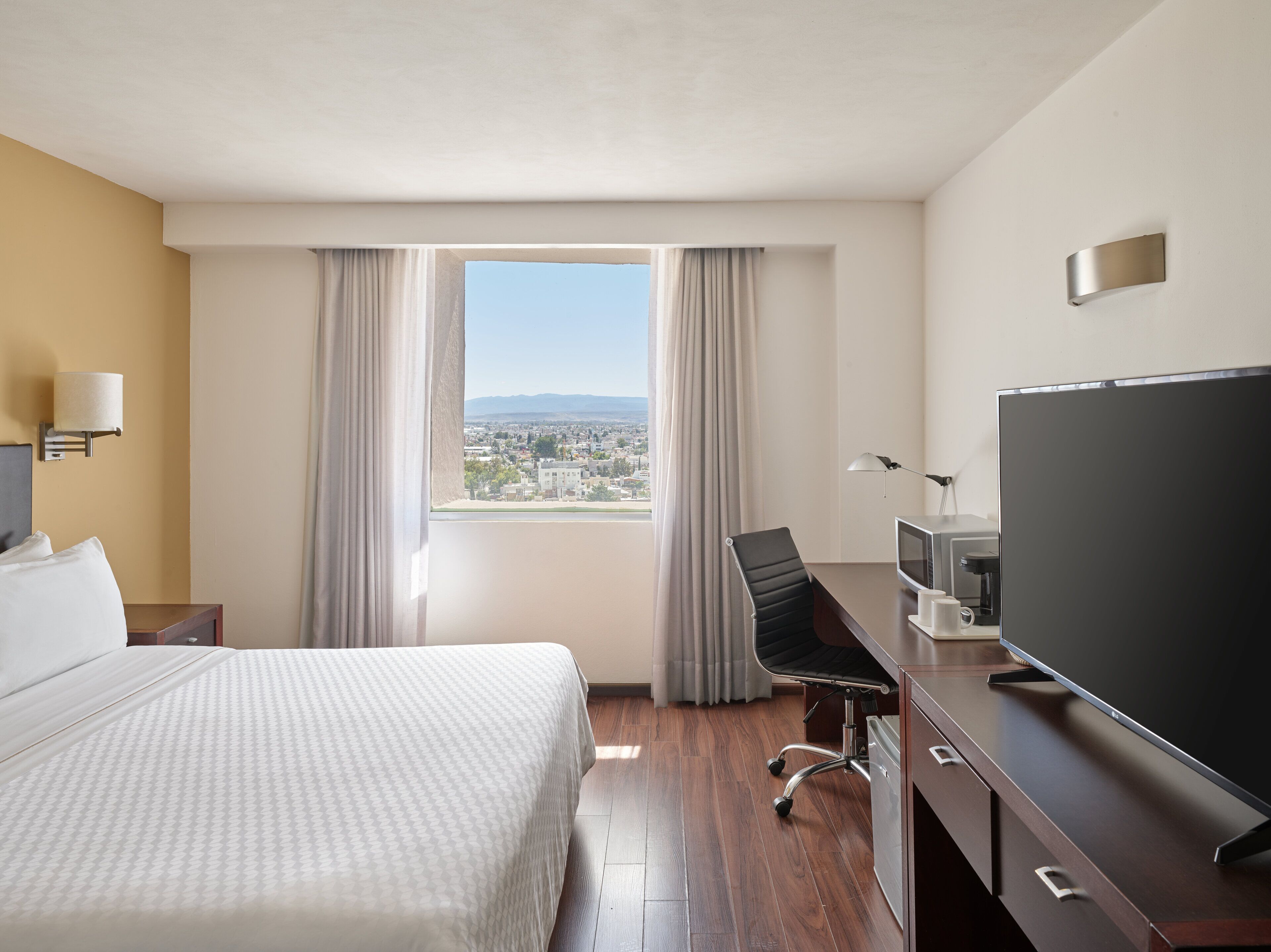 superior room, 1 king bed | in-room safe, desk, iron/ironing board, free rollaway beds