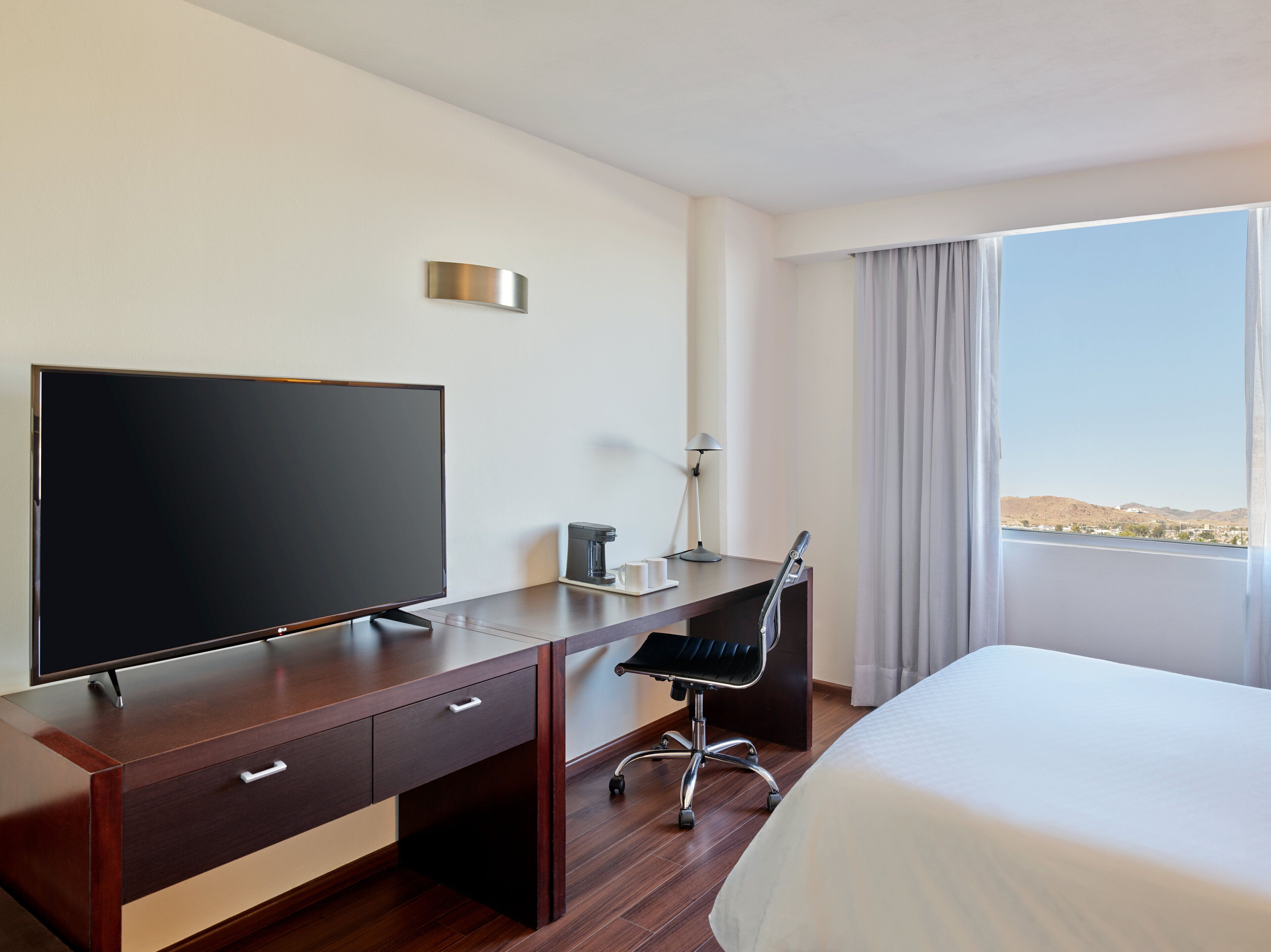 superior room, 1 king bed | in-room safe, desk, iron/ironing board, free rollaway beds