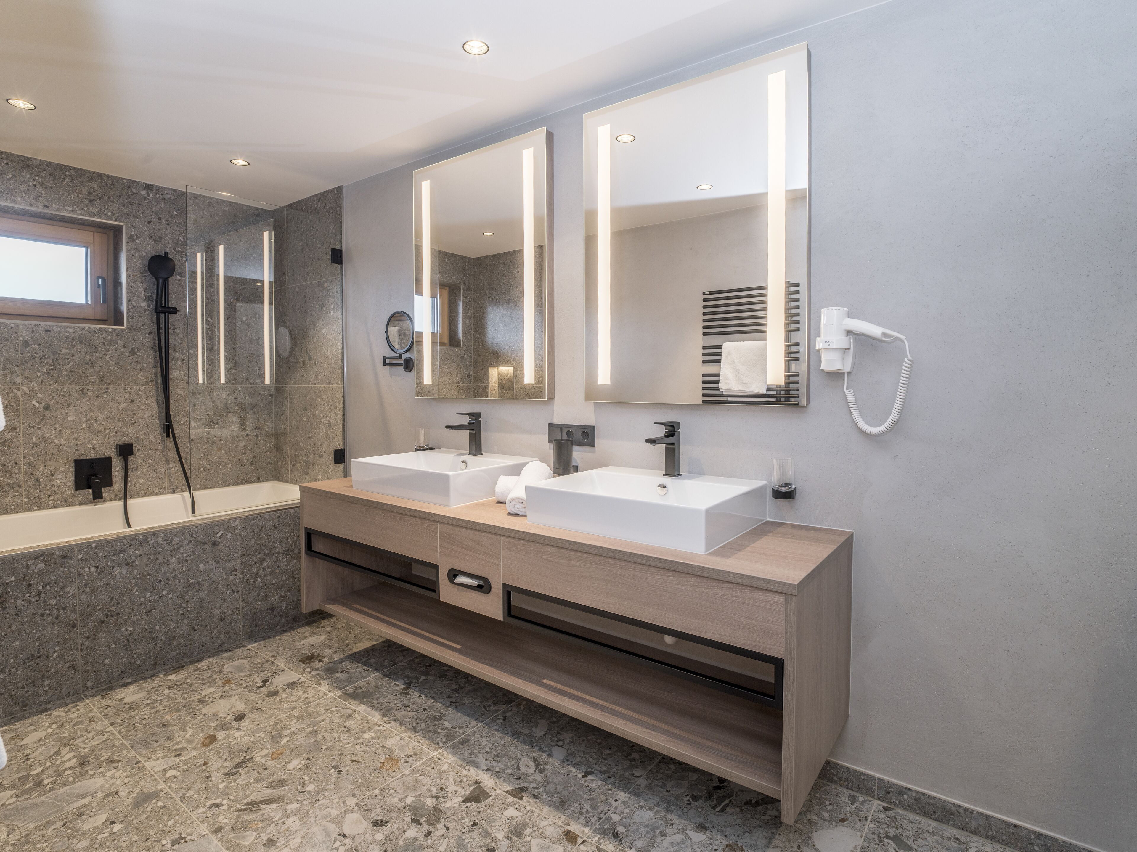 family suite deluxe | bathroom | eco-friendly toiletries, hair dryer, bathrobes, towels