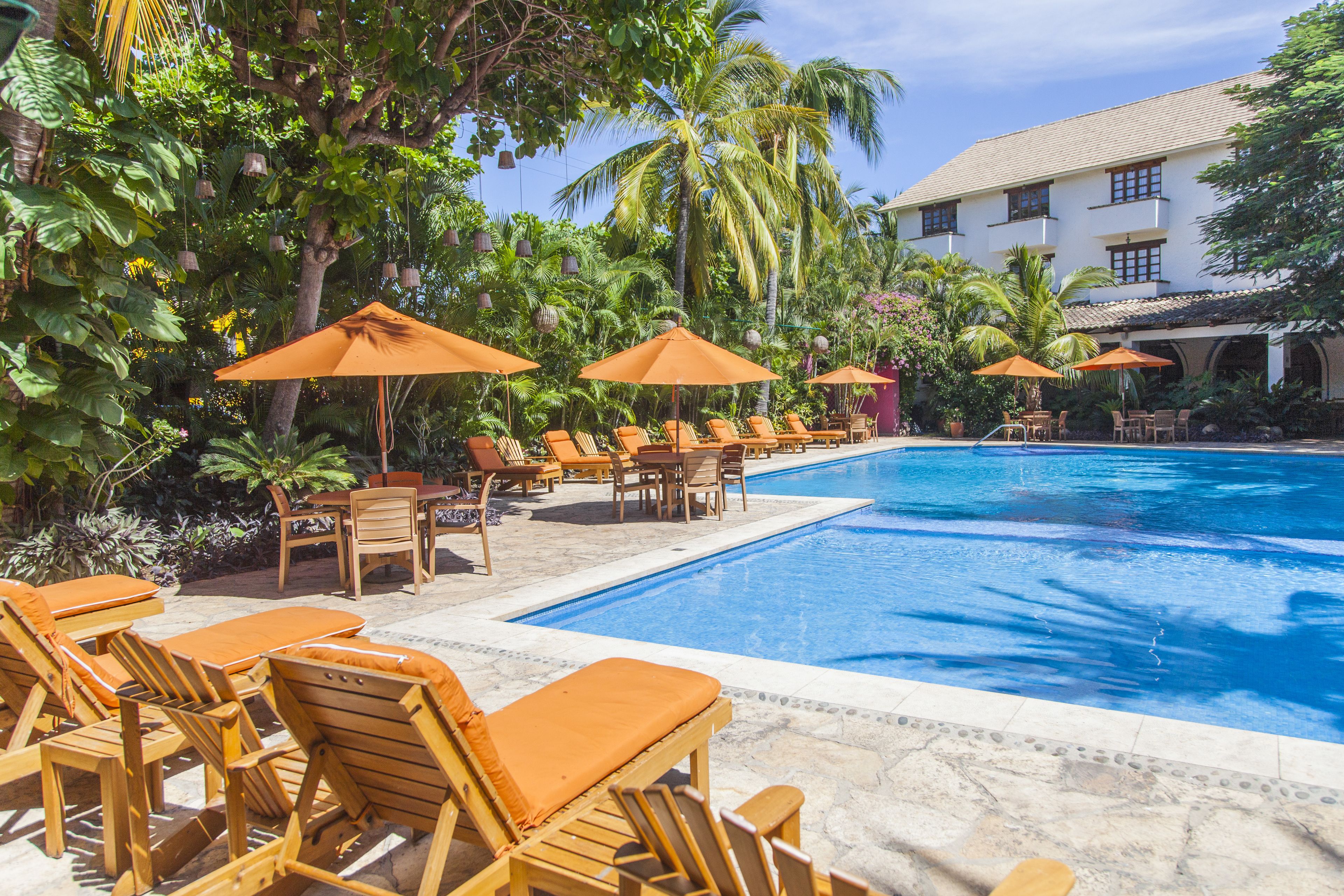 outdoor pool, open 10:00 am to 9:00 pm, pool umbrellas, pool loungers