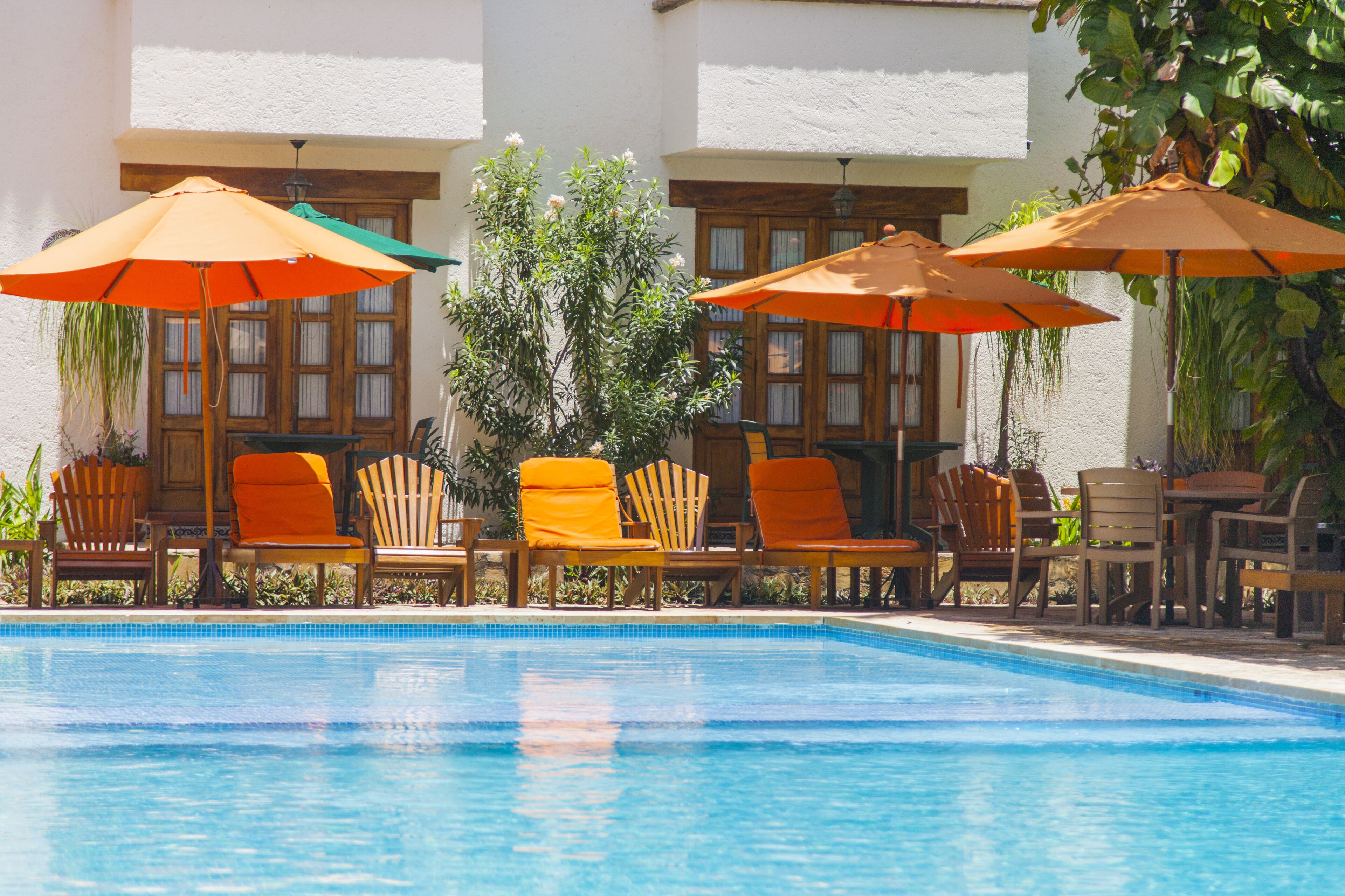 outdoor pool, open 10:00 am to 9:00 pm, pool umbrellas, pool loungers