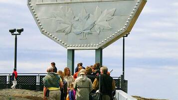 A large sign with the text "Canada Nickel 1951 Cents" and a maple leaf design.