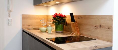 Fridge, microwave, stovetop, coffee/tea maker