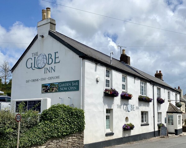 Experience the charm of The Globe Inn, where a traditional building offers a garden bar and live folk nights.