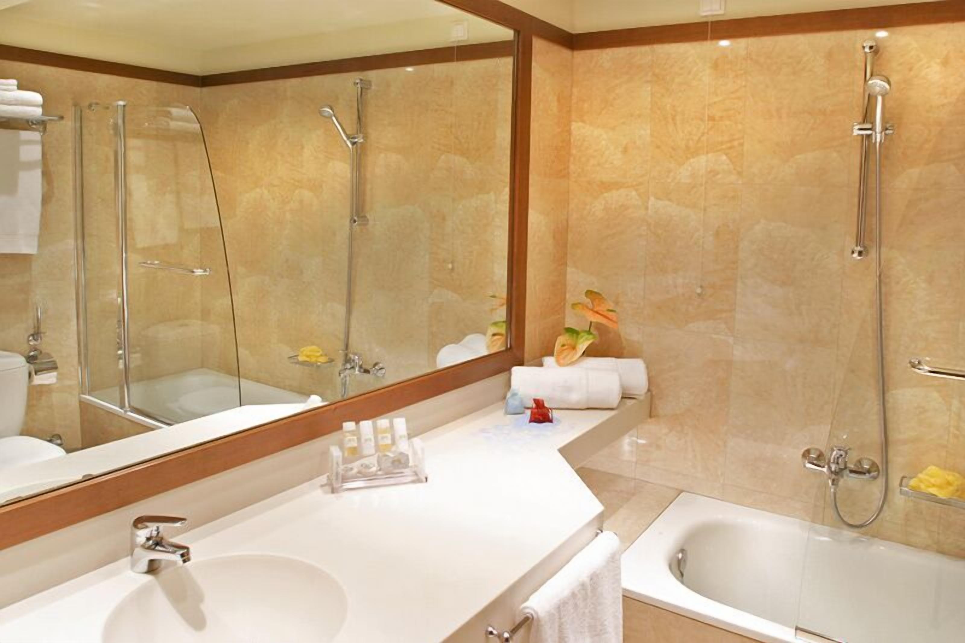 bathtub, free toiletries, hair dryer, bathrobes