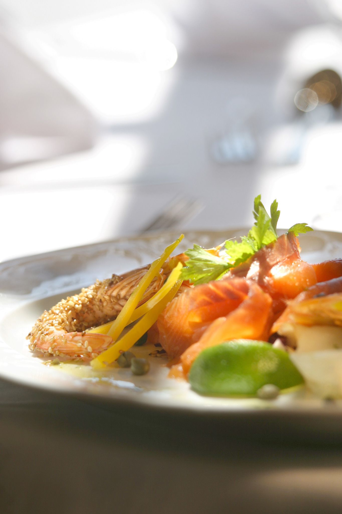 A plate of food with seafood and vegetables.