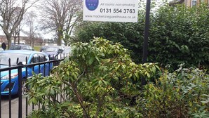 A sign for Mackenzie Guest House with contact details and a non-smoking policy. - Mackenzie Guest House (Edinburgh)