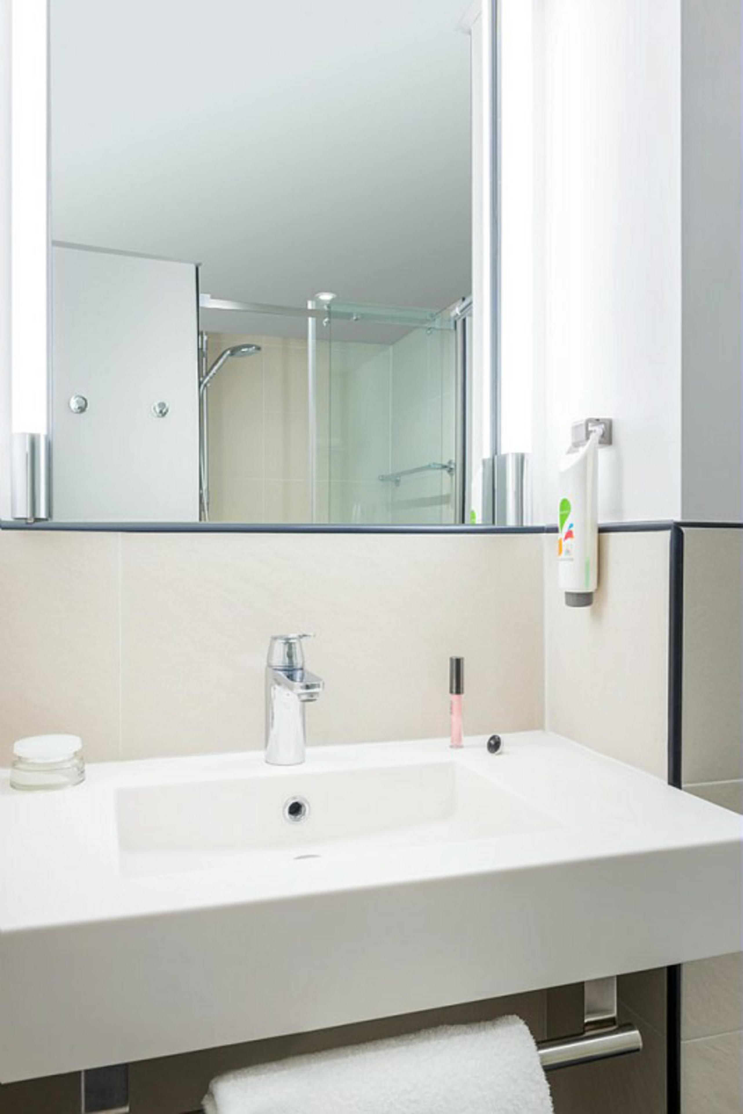 eco-friendly toiletries, hair dryer, towels