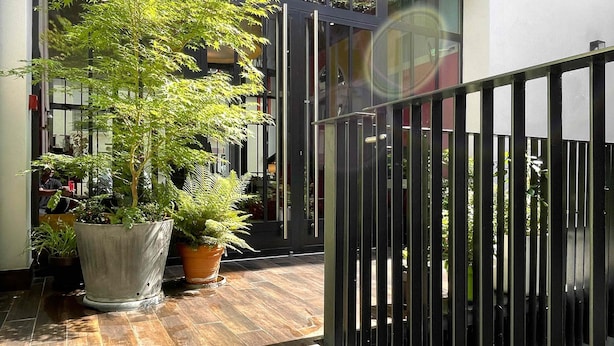 A modern building with large windows and a black gate. - ibis Styles Paris La Defense Courbevoie (Courbevoie)