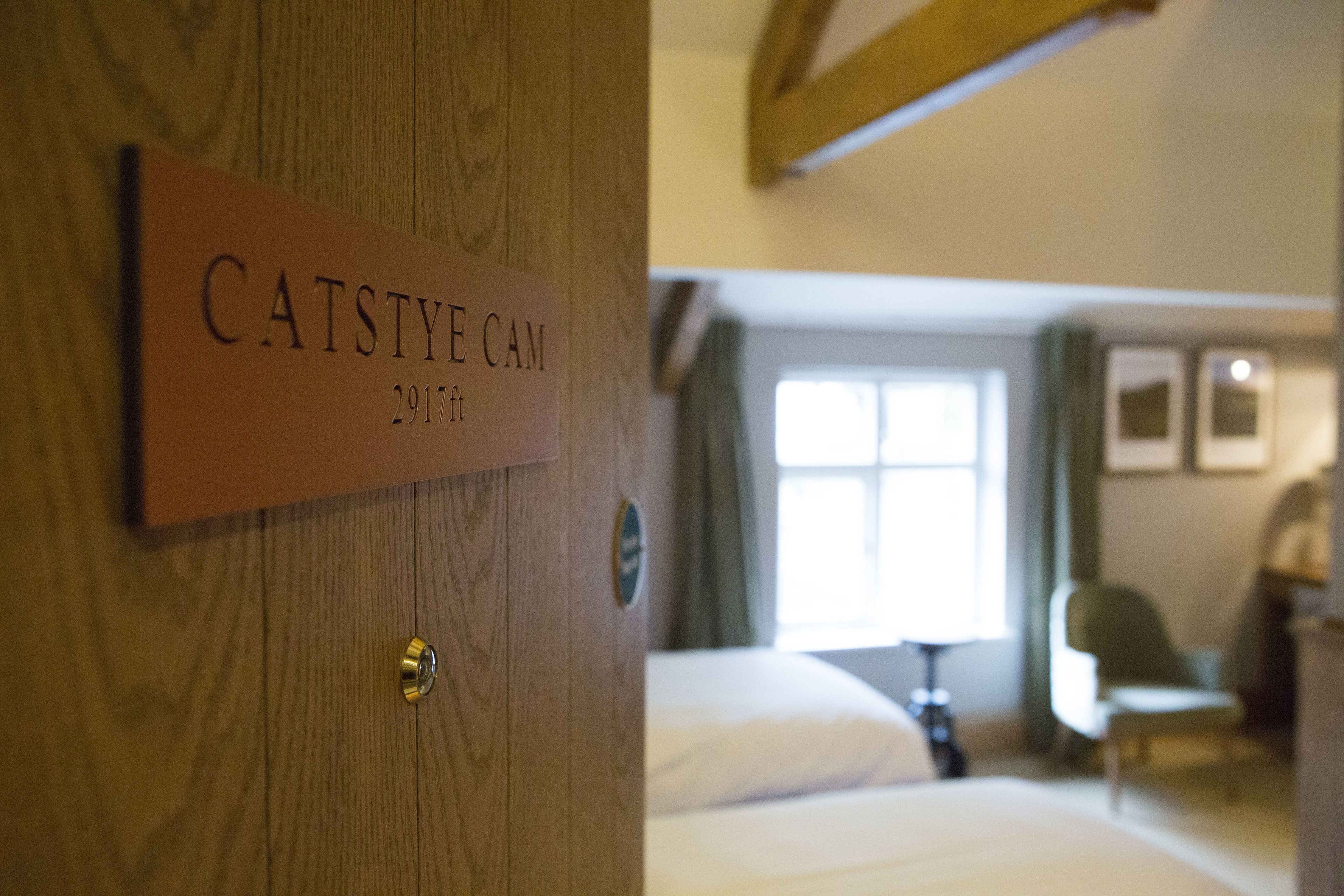 A wooden door with a sign reading "CATSTYE CAM 2917ft".