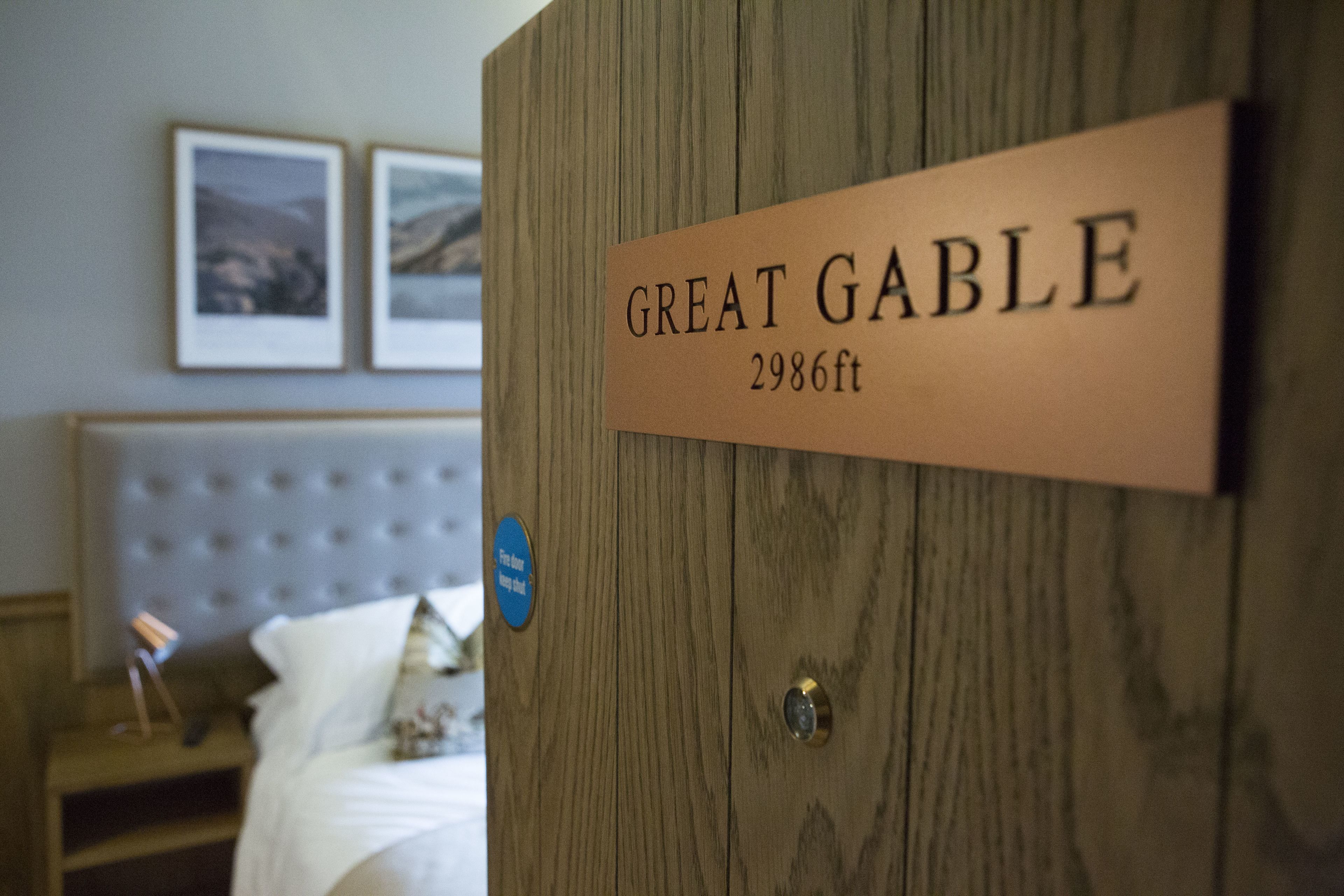 A wooden door with a sign reading "GREAT GABLE 2986ft."