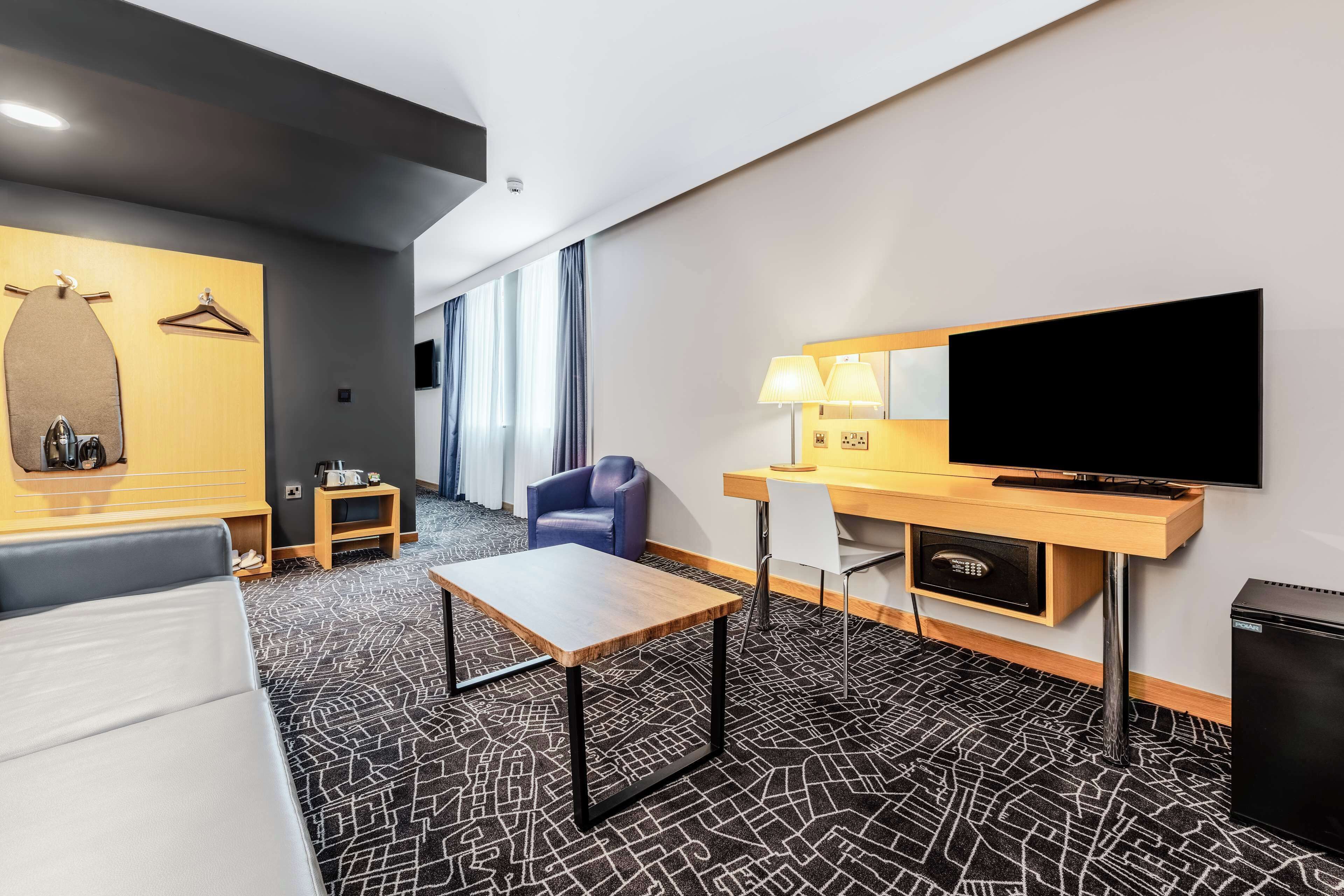 junior suite | in-room safe, desk, blackout curtains, soundproofing