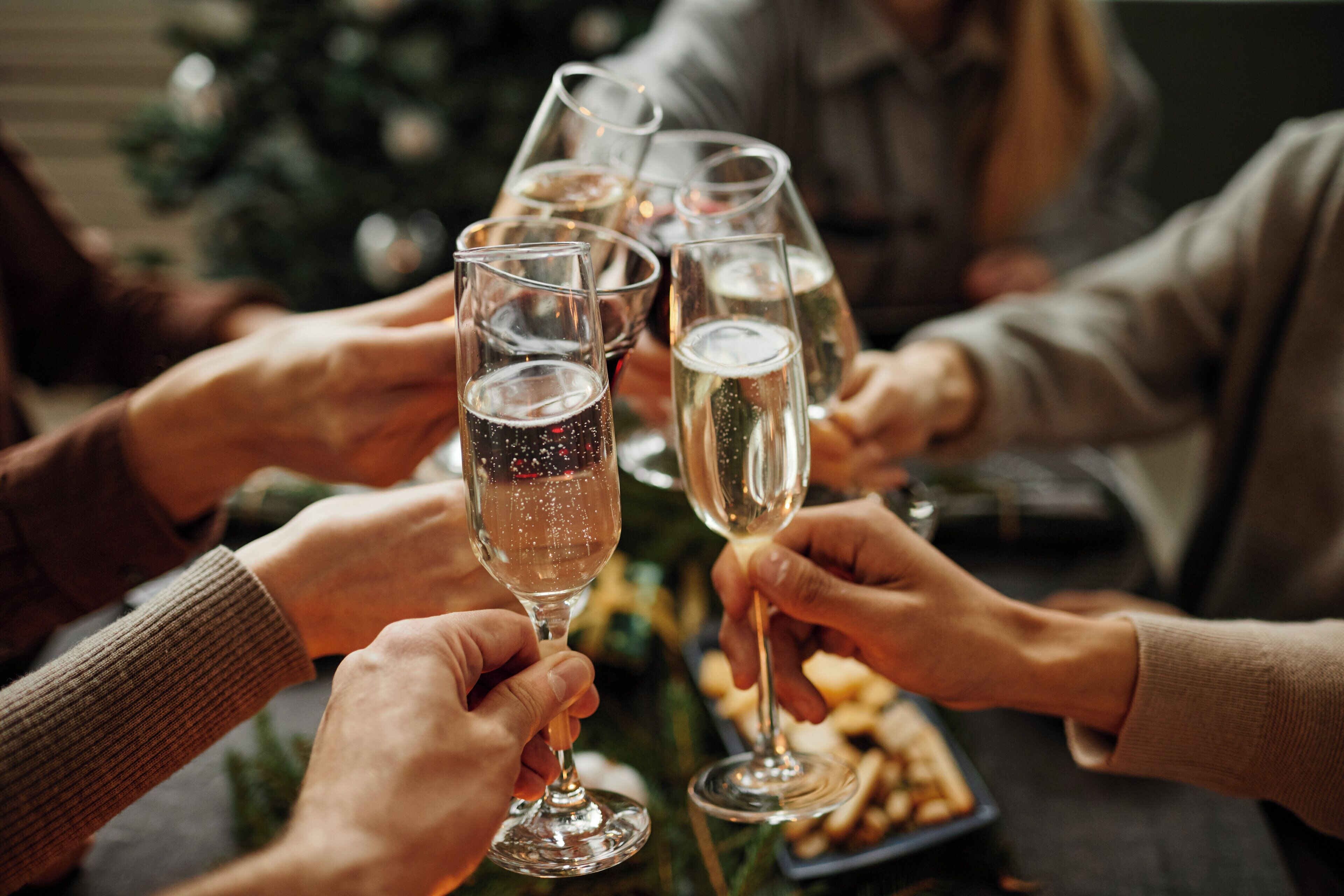 A group of people toasting with champagne glasses.
