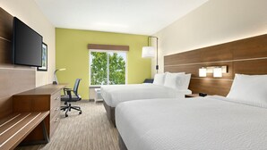 A hotel room with two beds, a desk, a chair, a TV, and a window with a view of trees. - Holiday Inn Express & Suites Akron Regional Airport Area by IHG (Akron)