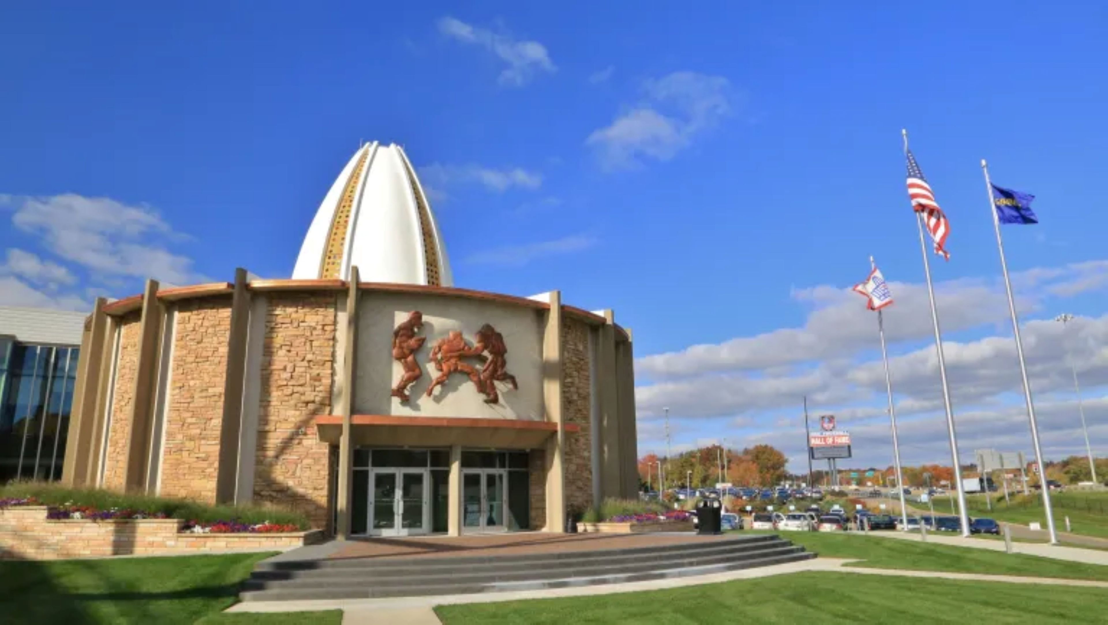 A building with a central dome, a stone facade, and a large entrance.