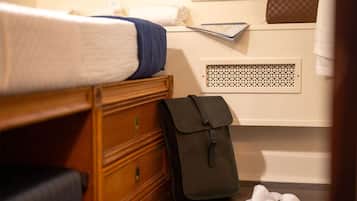 Luxe beddengoed, een kluis op de kamer, een strijkplank/strijkijzer