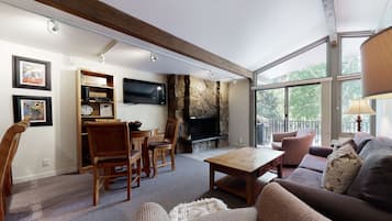 Platinum, 1 Bedroom | Living area | TV, fireplace