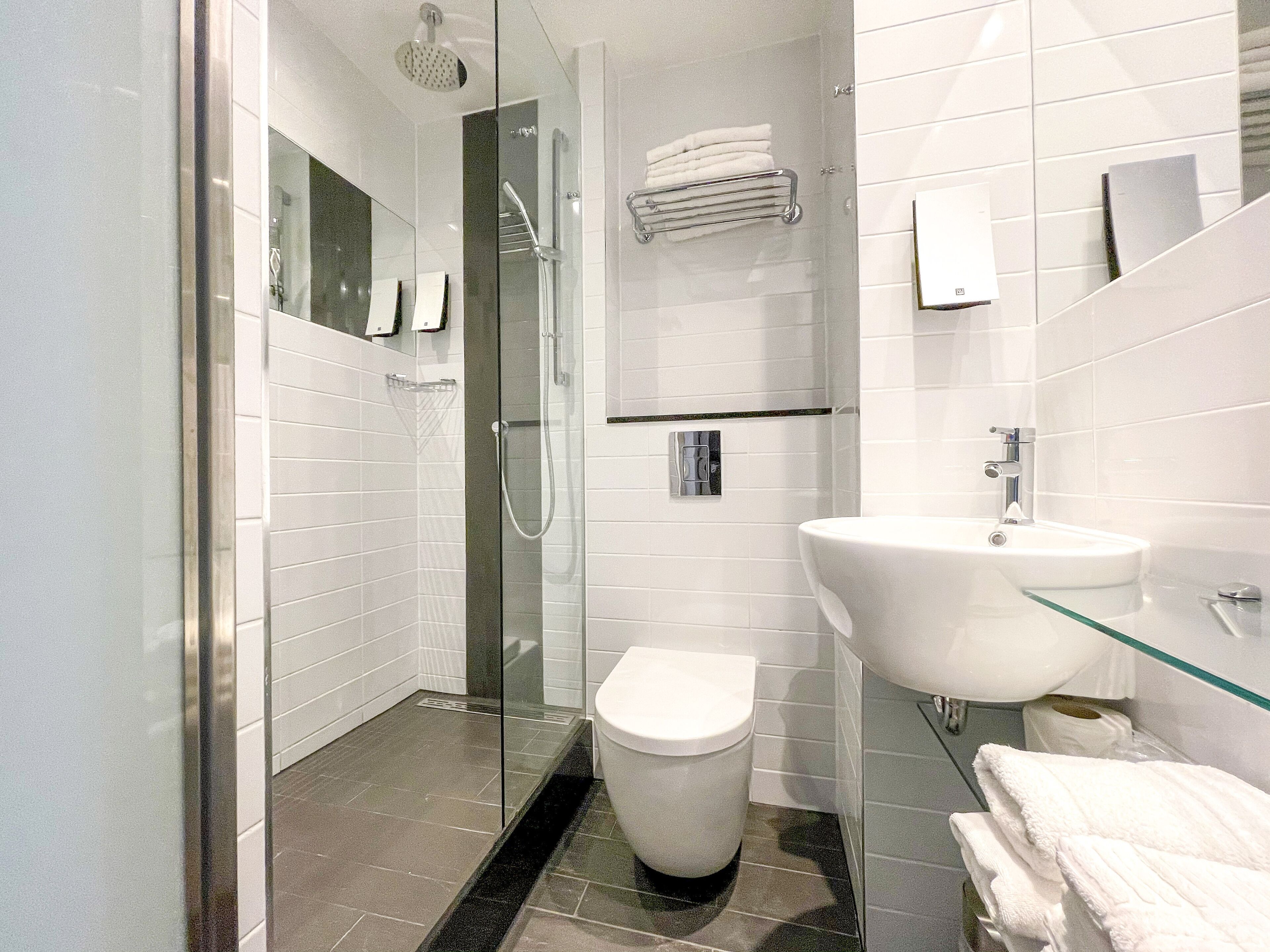 family room | bathroom | shower, free toiletries, hair dryer, towels