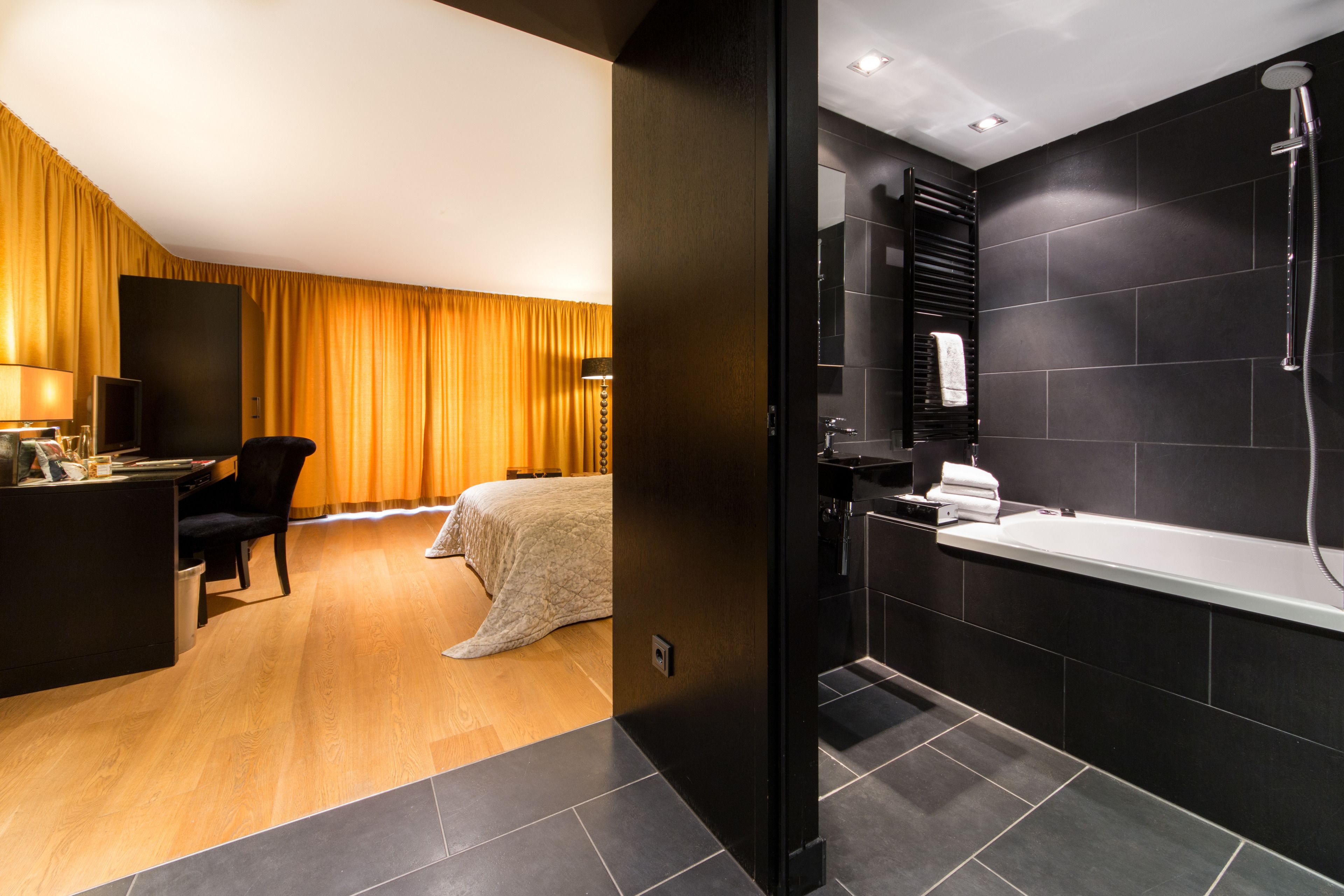 deep-soaking bathtub, designer toiletries, hair dryer, slippers