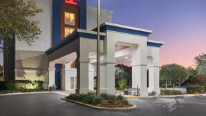 A Hampton Inn by Hilton hotel with a modern facade, large entrance canopy, and well-maintained landscaping. - Hampton Inn Leesburg/Tavares (Leesburg)