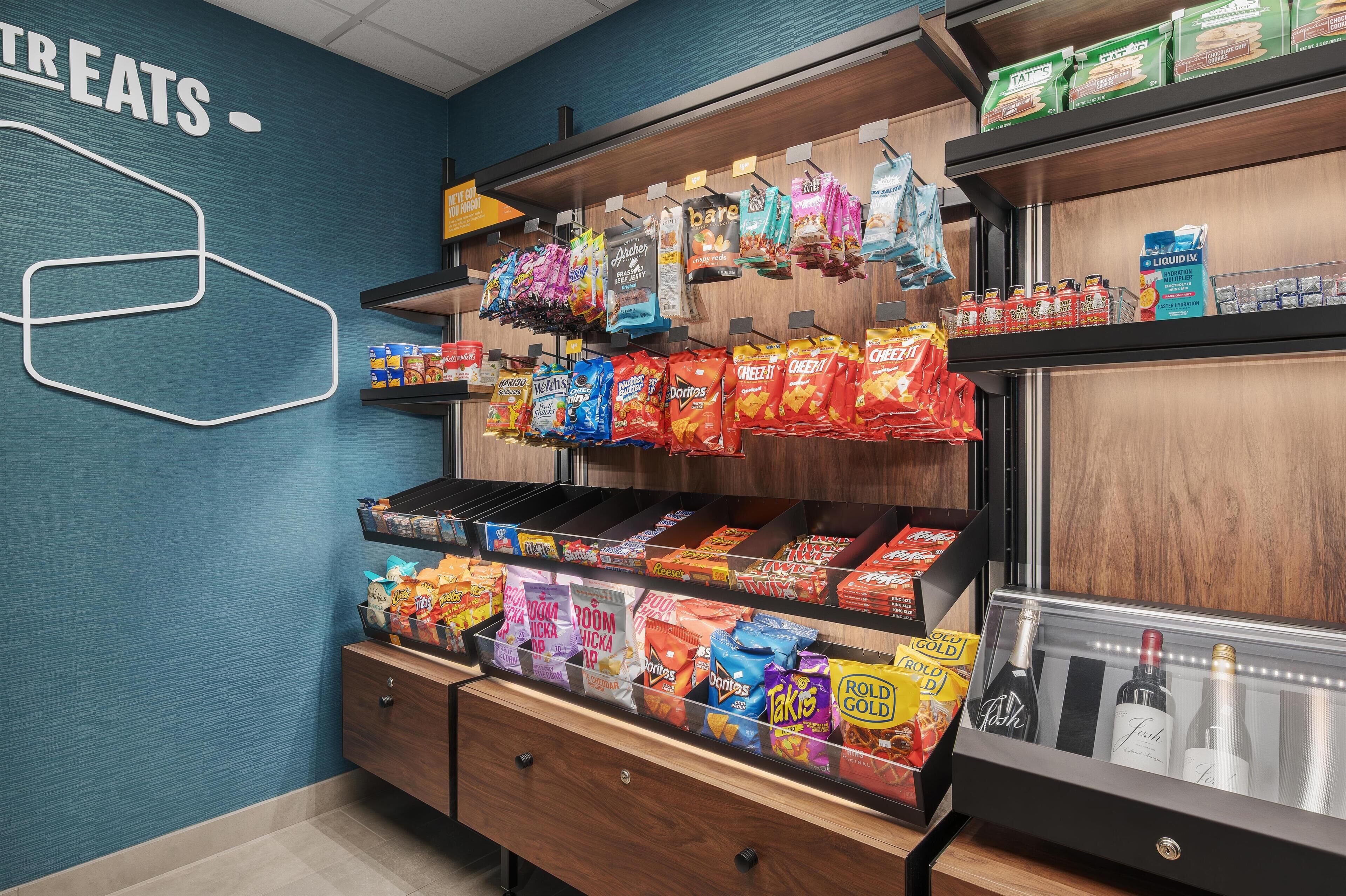 A snack display with various chips and snacks.