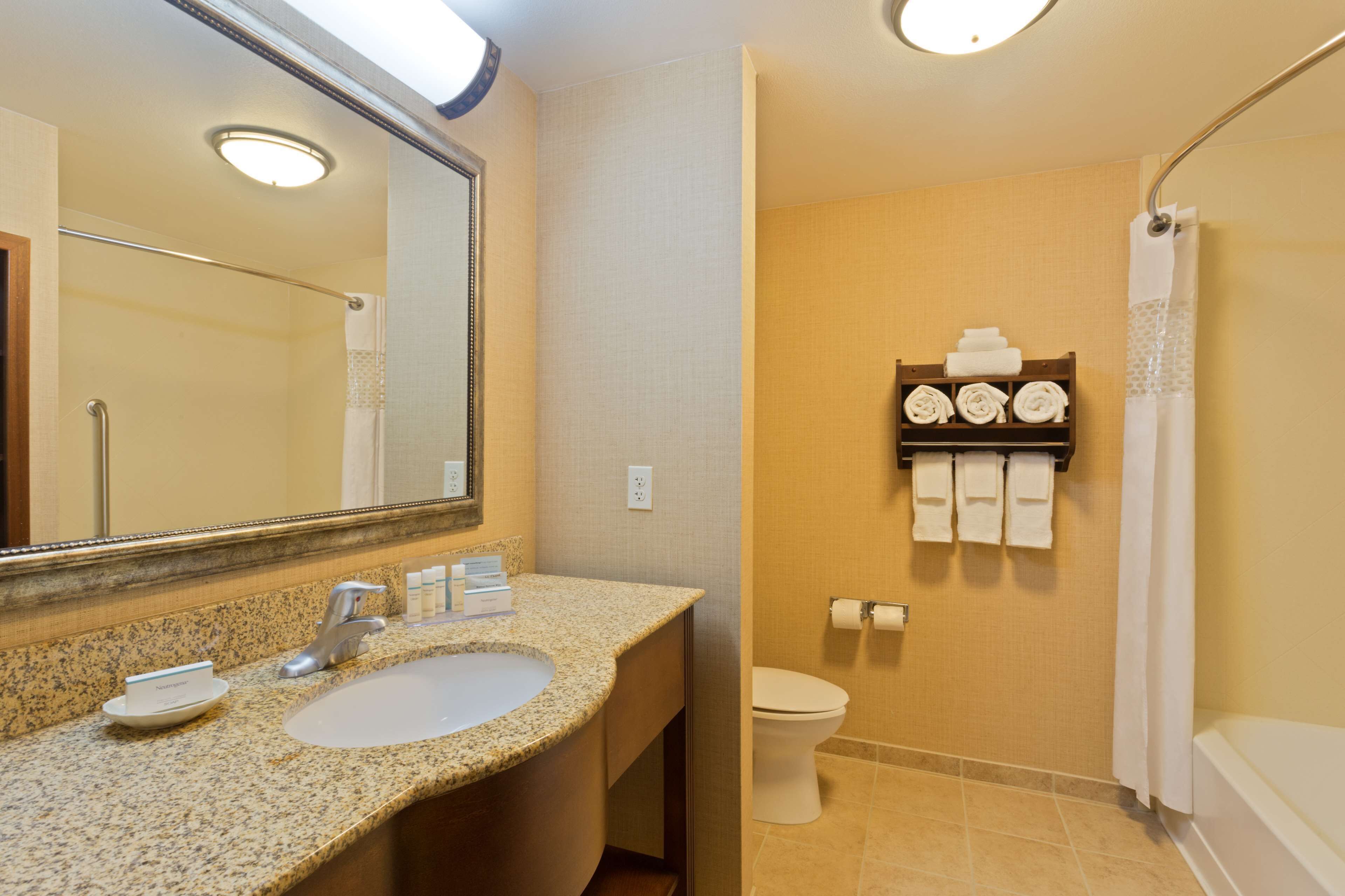 standard room with two queen beds | bathroom | combined shower/bathtub, free toiletries, hair dryer, towels