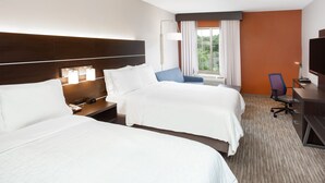 A hotel room with two beds, a desk, a chair, a TV, and a window with curtains. - Holiday Inn Express Haskell - Wayne Area by IHG (Wanaque)