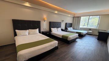 Habitación ejecutiva | Ropa de cama de alta calidad y minibar