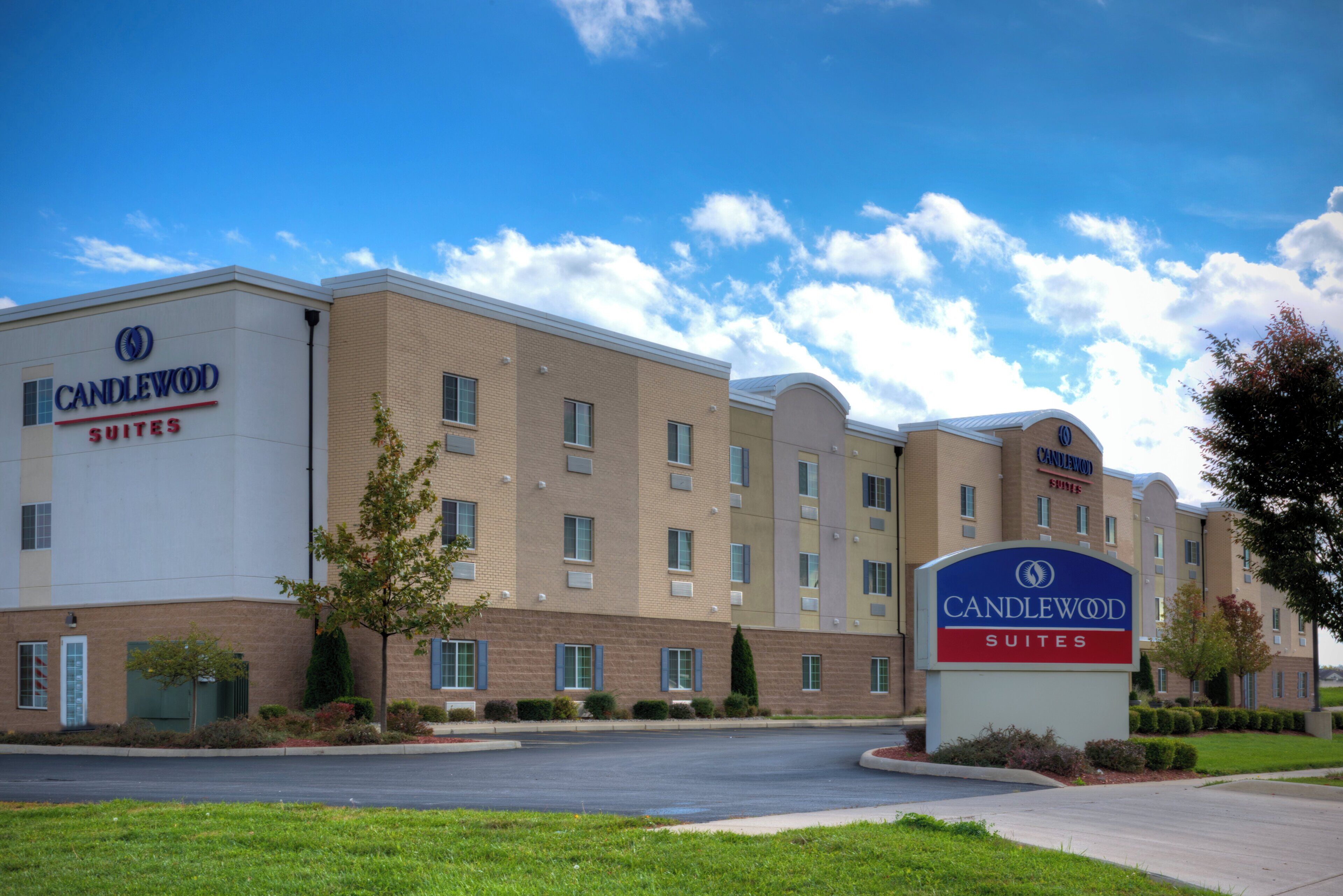 A hotel with a sign reading 'Candlewood Suites.'