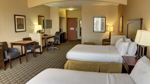 A hotel room with two beds, a desk, a chair, a TV, and a door leading to another room. - Holiday Inn Express Hotel & Suites Huntsville by IHG (Huntsville)