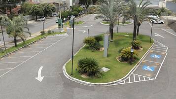 A parking lot with directional arrows and handicapped parking spaces.