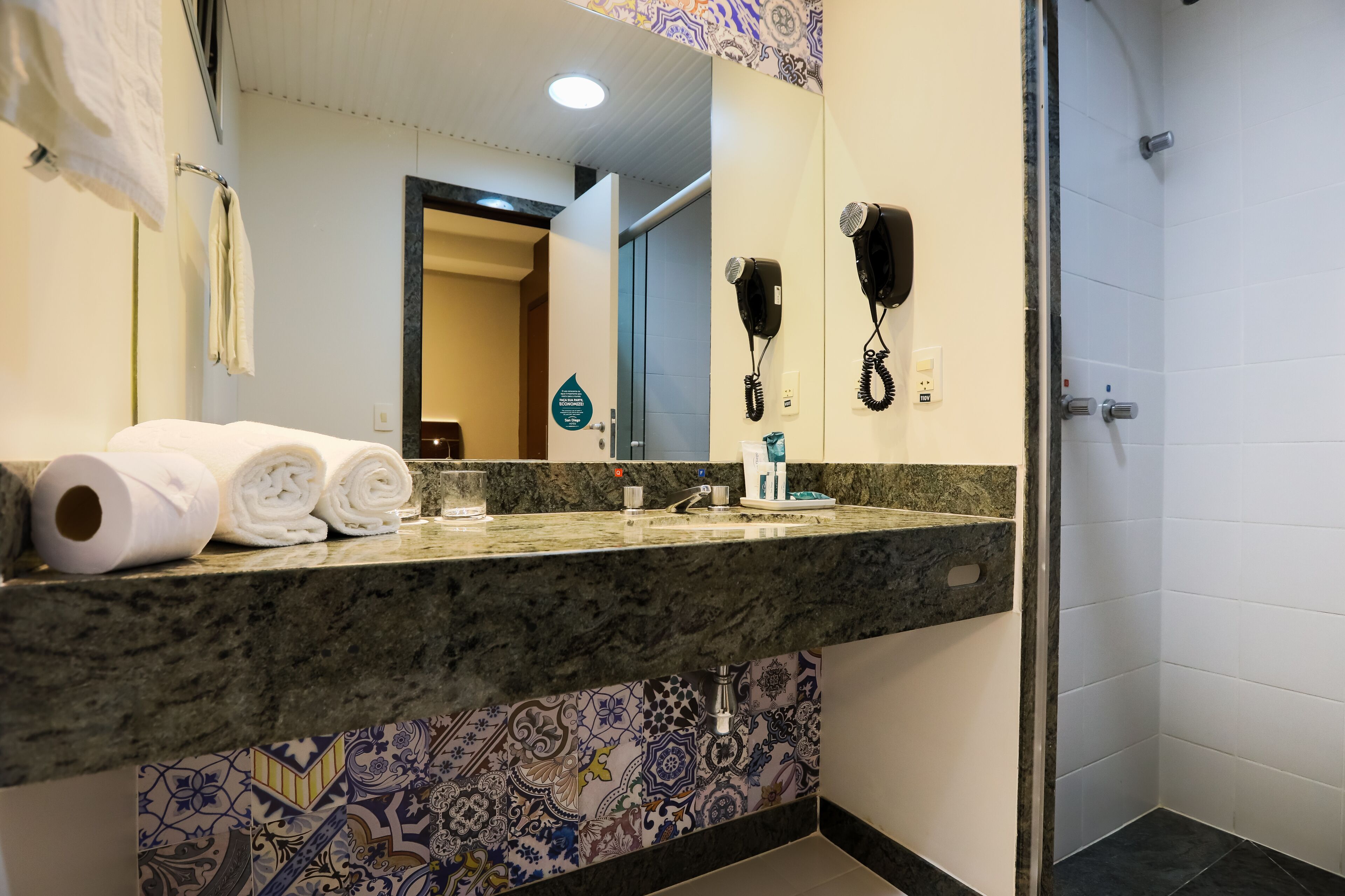 shower, free toiletries, hair dryer, towels