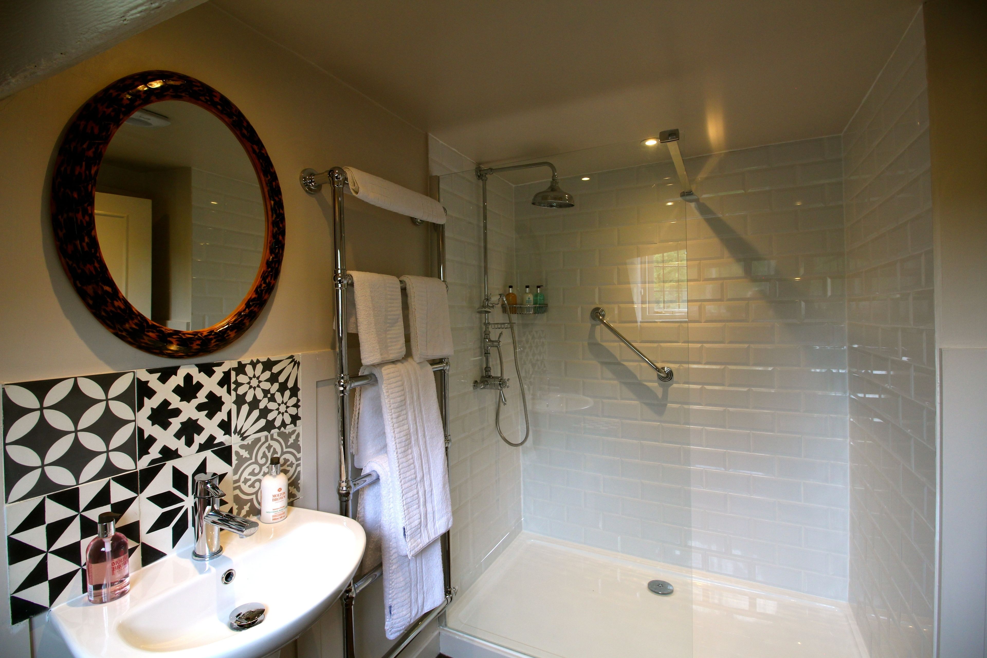 superior double room | bathroom | designer toiletries, hair dryer, towels